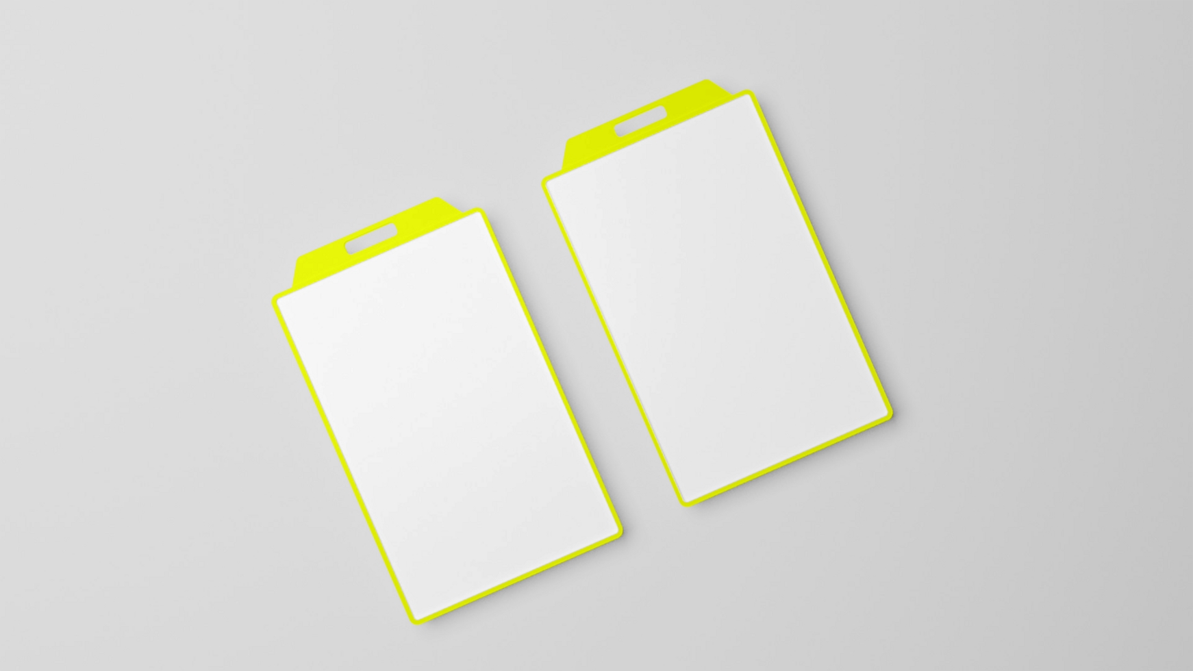 Two yellow and white blank cards on a gray surface psd