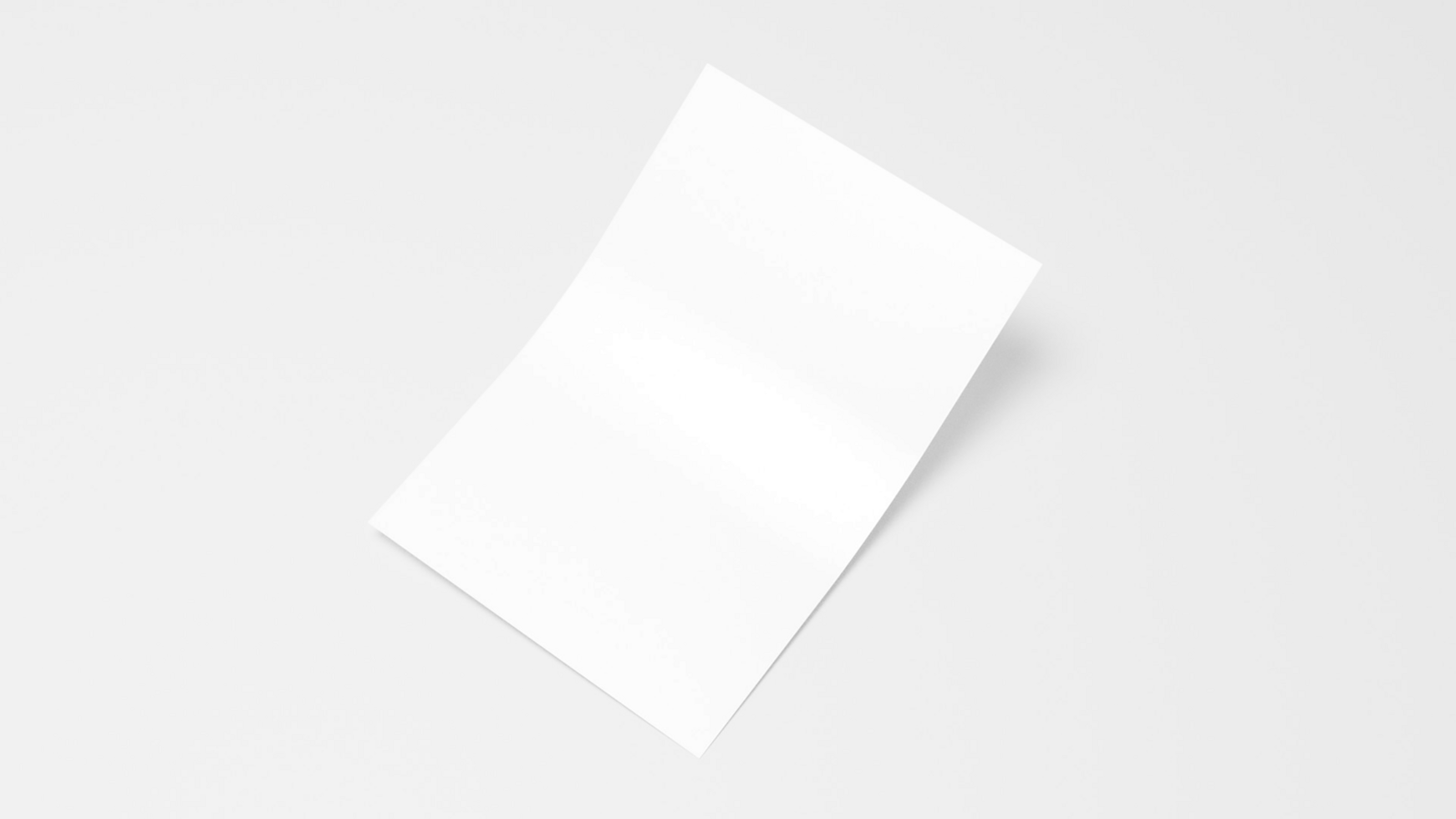 A white sheet of paper on a table psd