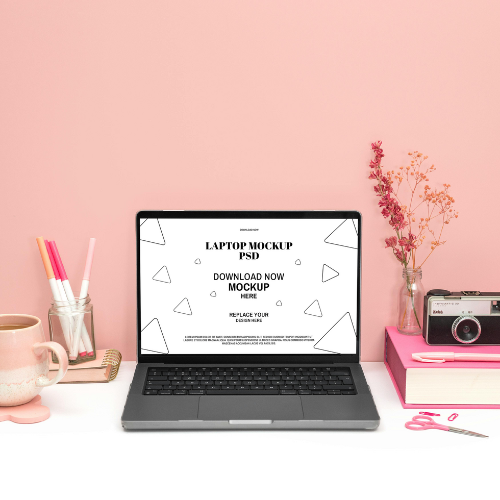 Laptop Mockup on a Pink Aesthetic Workspace psd