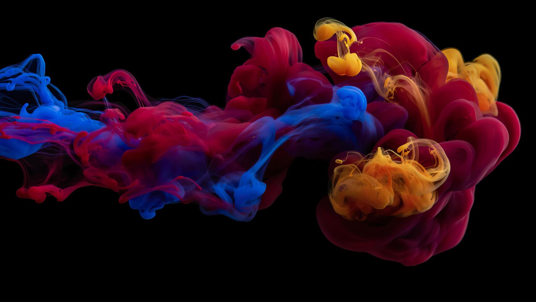 Colorful ink in water on a black background photo