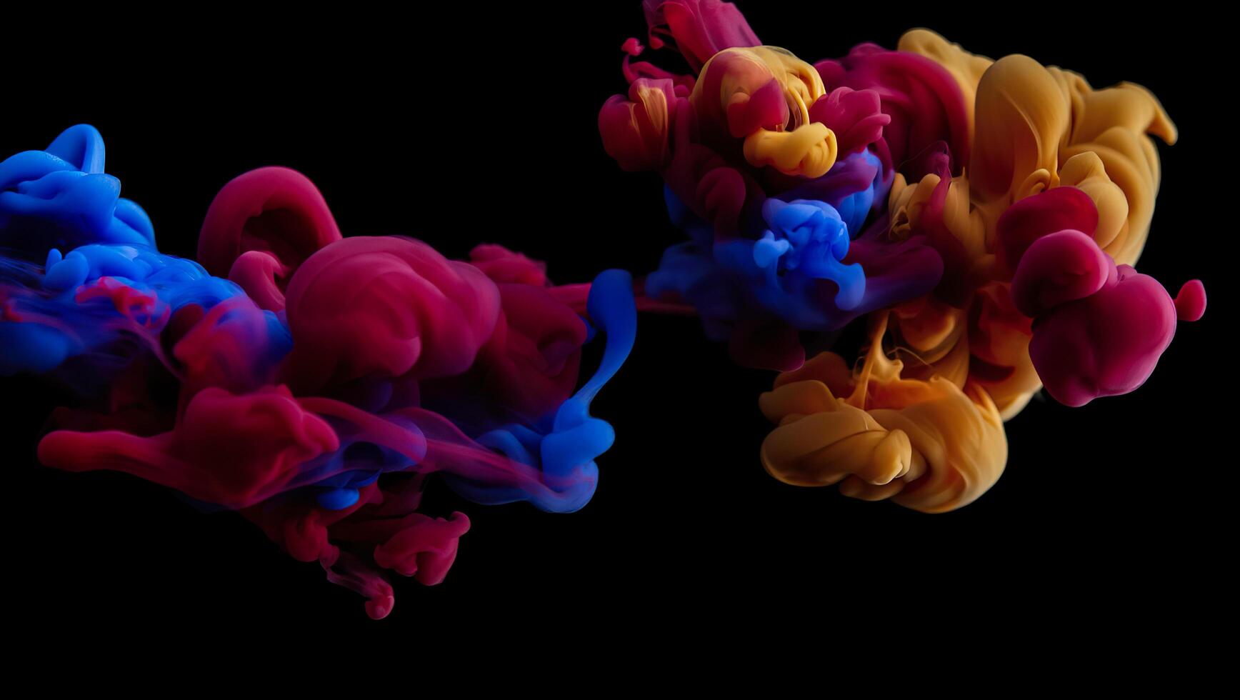 Colorful ink in water on black background photo