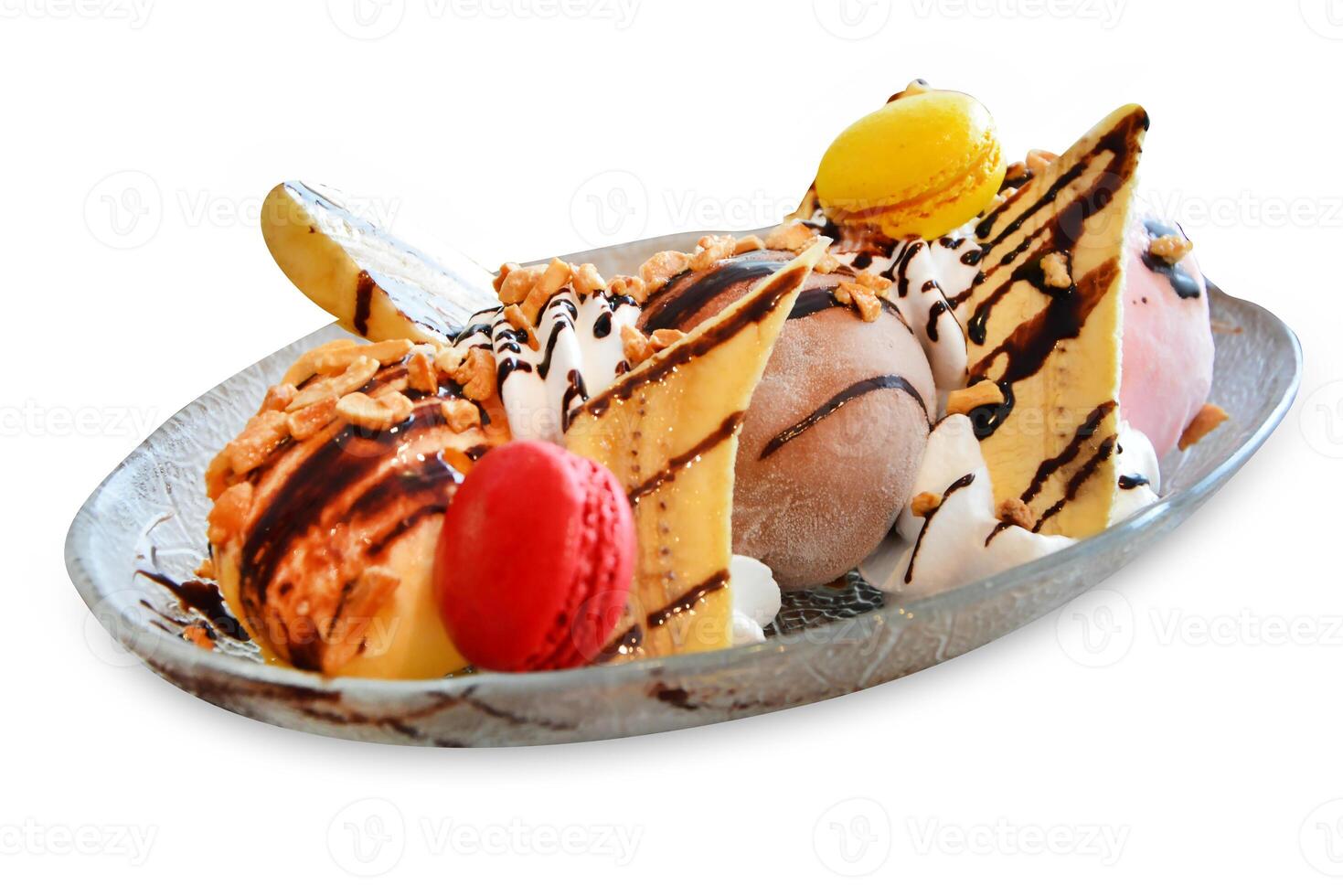 Top view of ice cream with banana and chocolate sauce and Macarons, focus selective photo