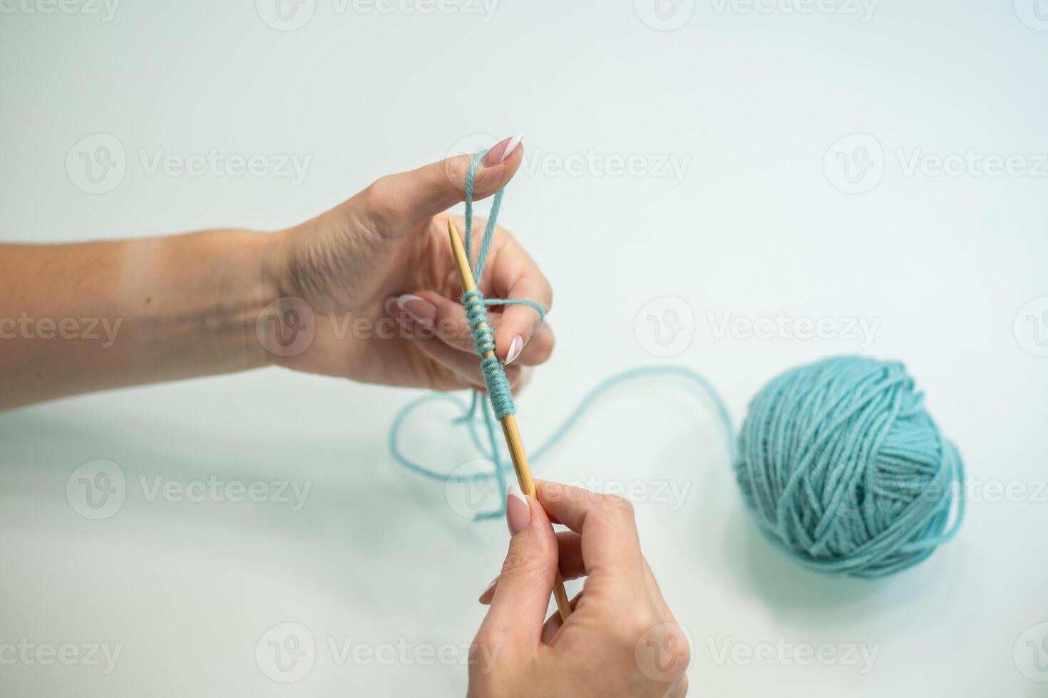 set of loops on the needles step by step. wool and cotton knitting photo