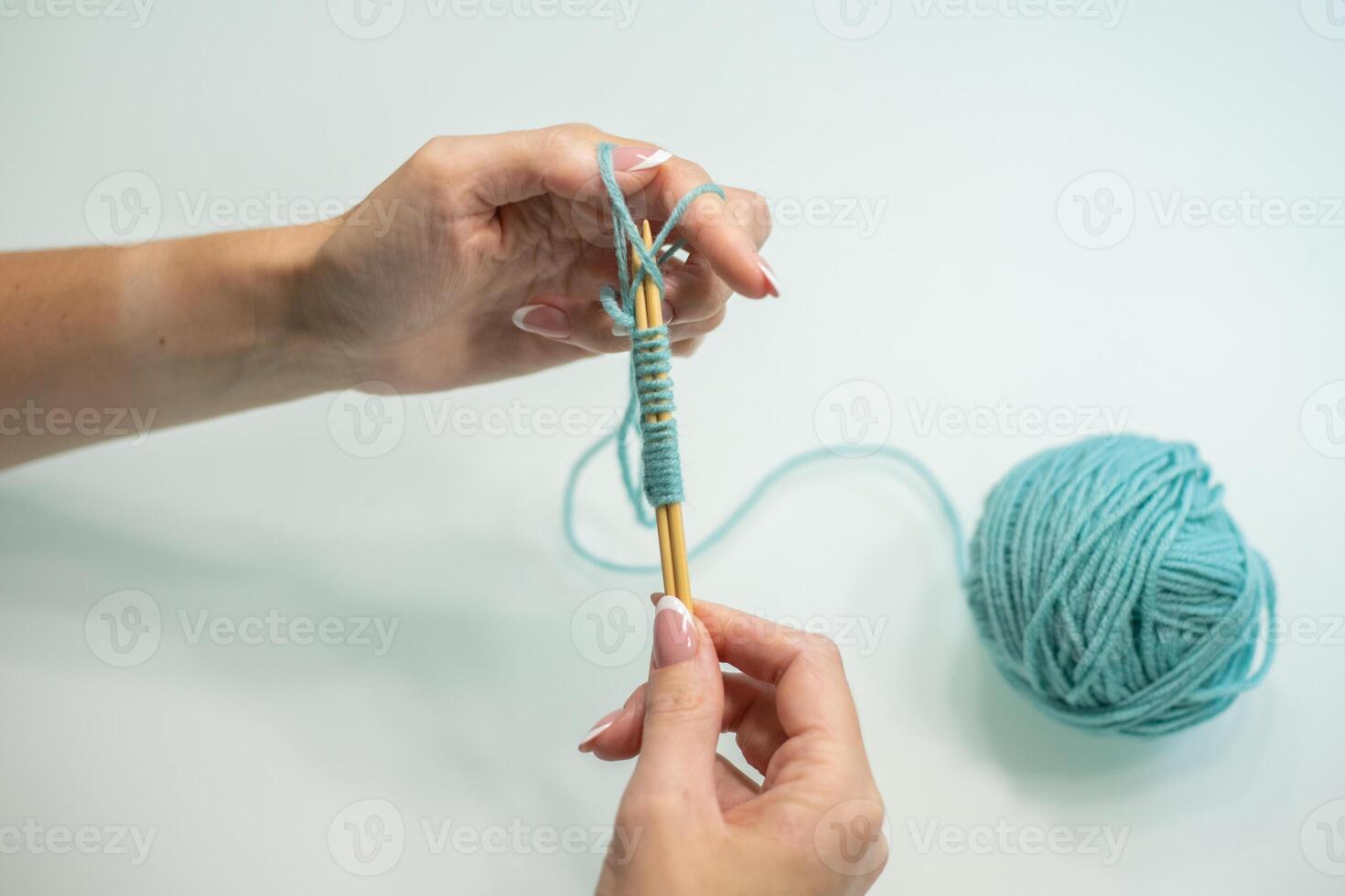 set of loops on the needles step by step. wool and cotton knitting photo