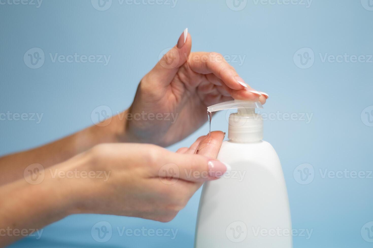 Washing hands.Jungian hands use liquid soap to wash hands, hygiene concept for protection from coronavirus pandemic, isolated on blue white background, closeup photo