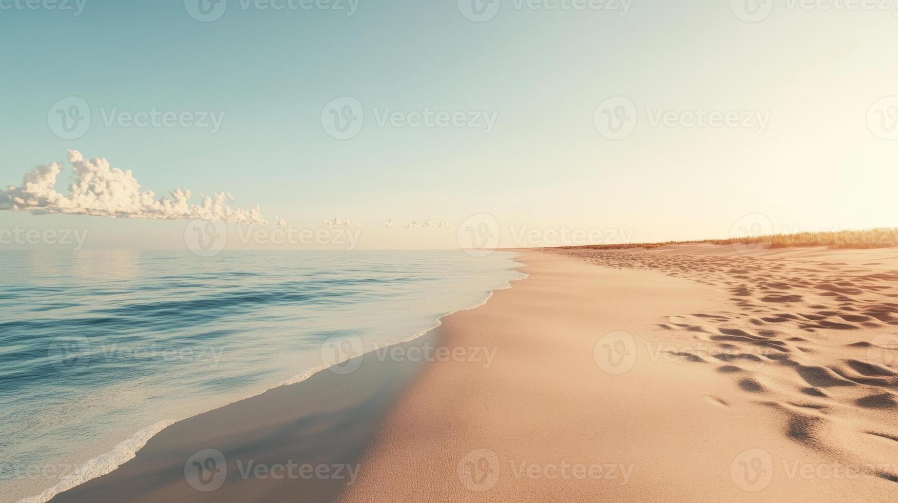 Soft sand and calm sea create a tranquil atmosphere on an empty beach at sunset photo