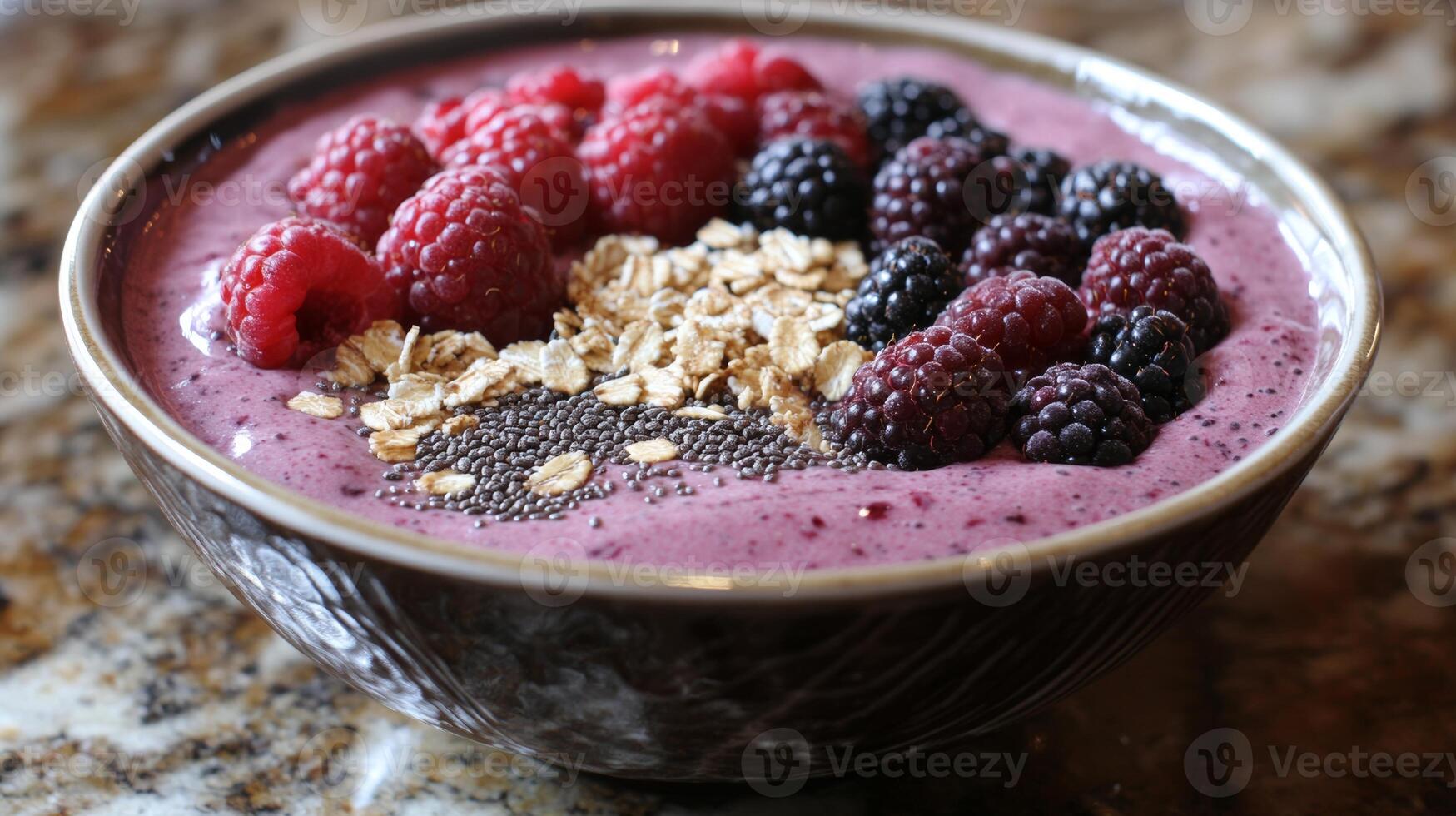Refreshing berry smoothie bowl topped with oats and chia seeds for a healthy breakfast option photo