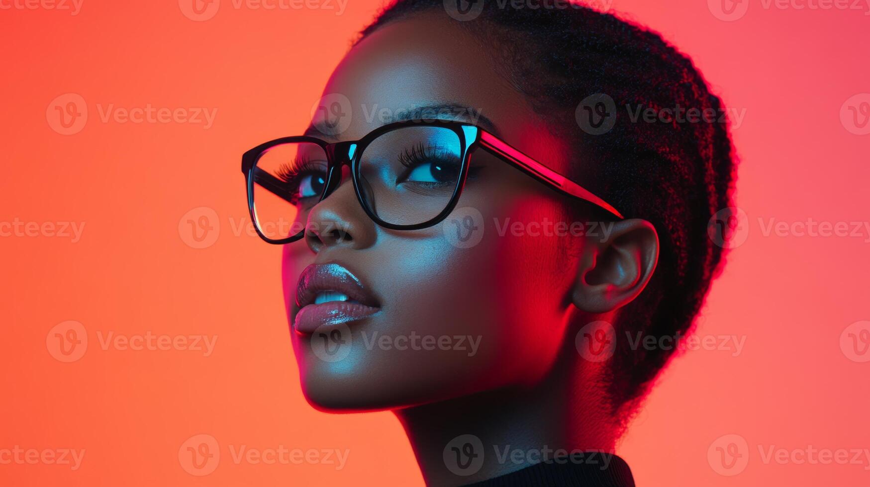 Portrait of a young woman with glasses showcasing vibrant colors in urban setting during evening photo