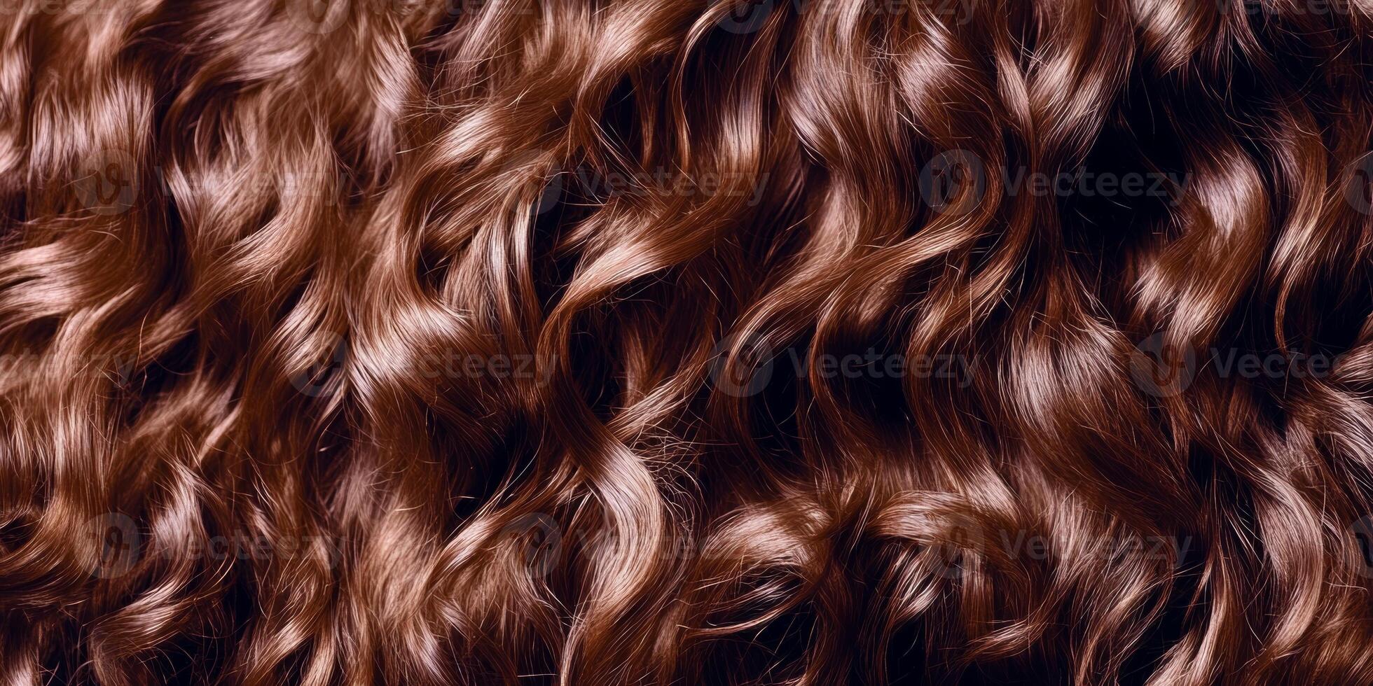 Curly brown hair with rich texture and sheen displayed in close-up under soft lighting photo