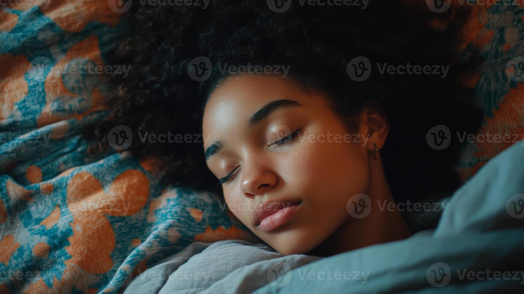 Peaceful woman resting on colorful bedding with eyes closed in a serene indoor environment photo