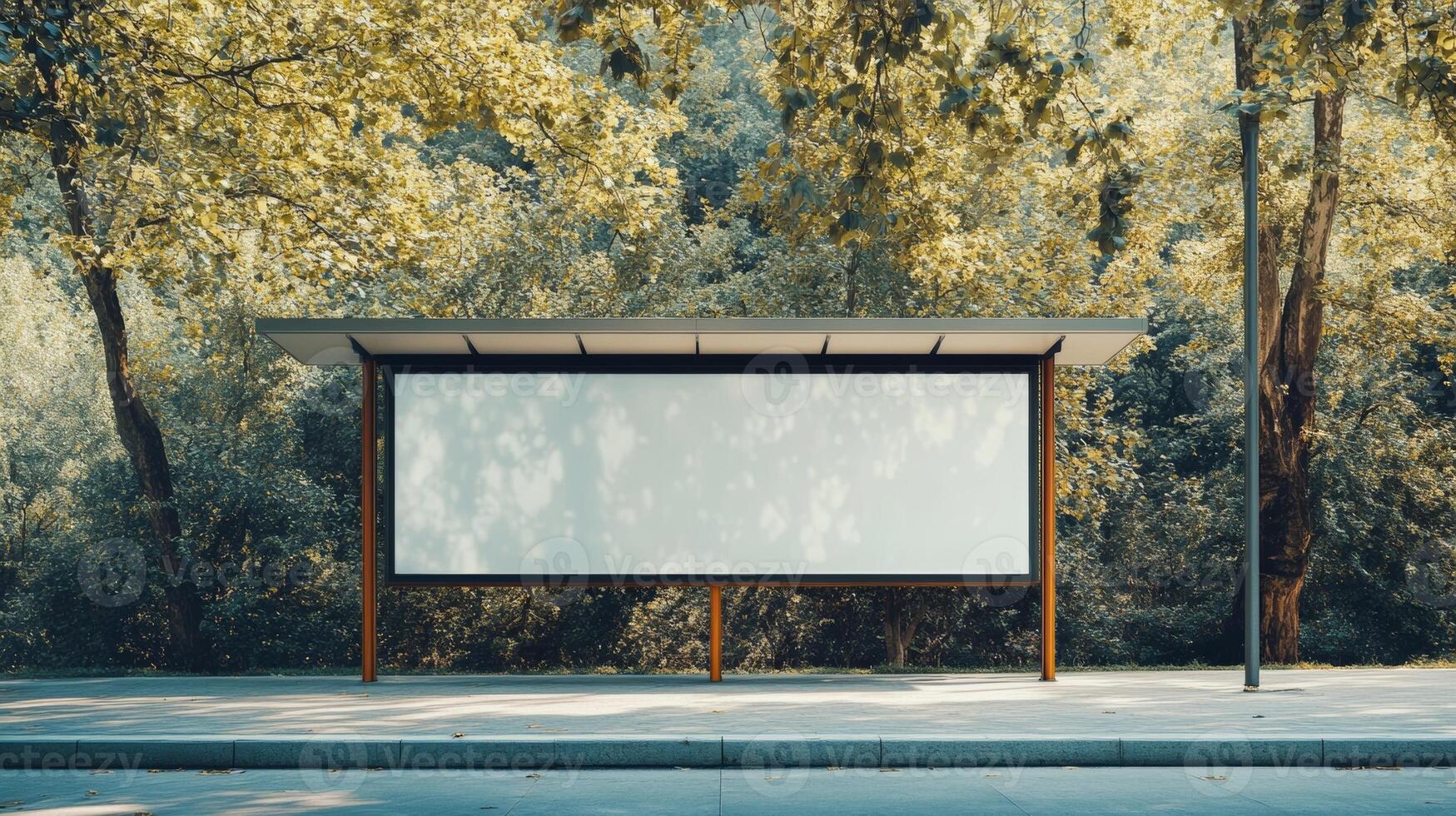 Billboard stands empty in a scenic park surrounded by lush greenery during bright daylight photo
