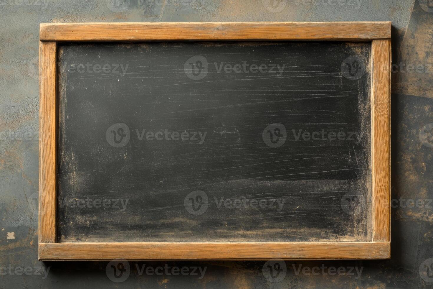 Empty blackboard with wooden frame ready for new lessons in a classroom setting photo