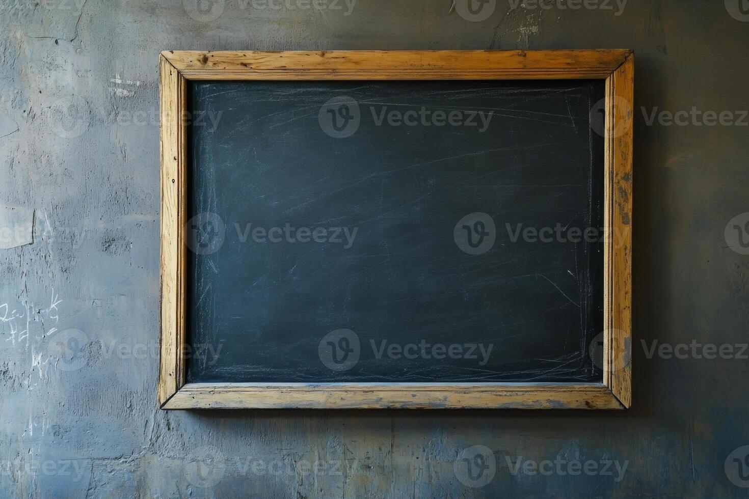 Empty chalkboard hanging on a textured wall in a classroom setting during daylight hours, inviting thoughts and creativity photo