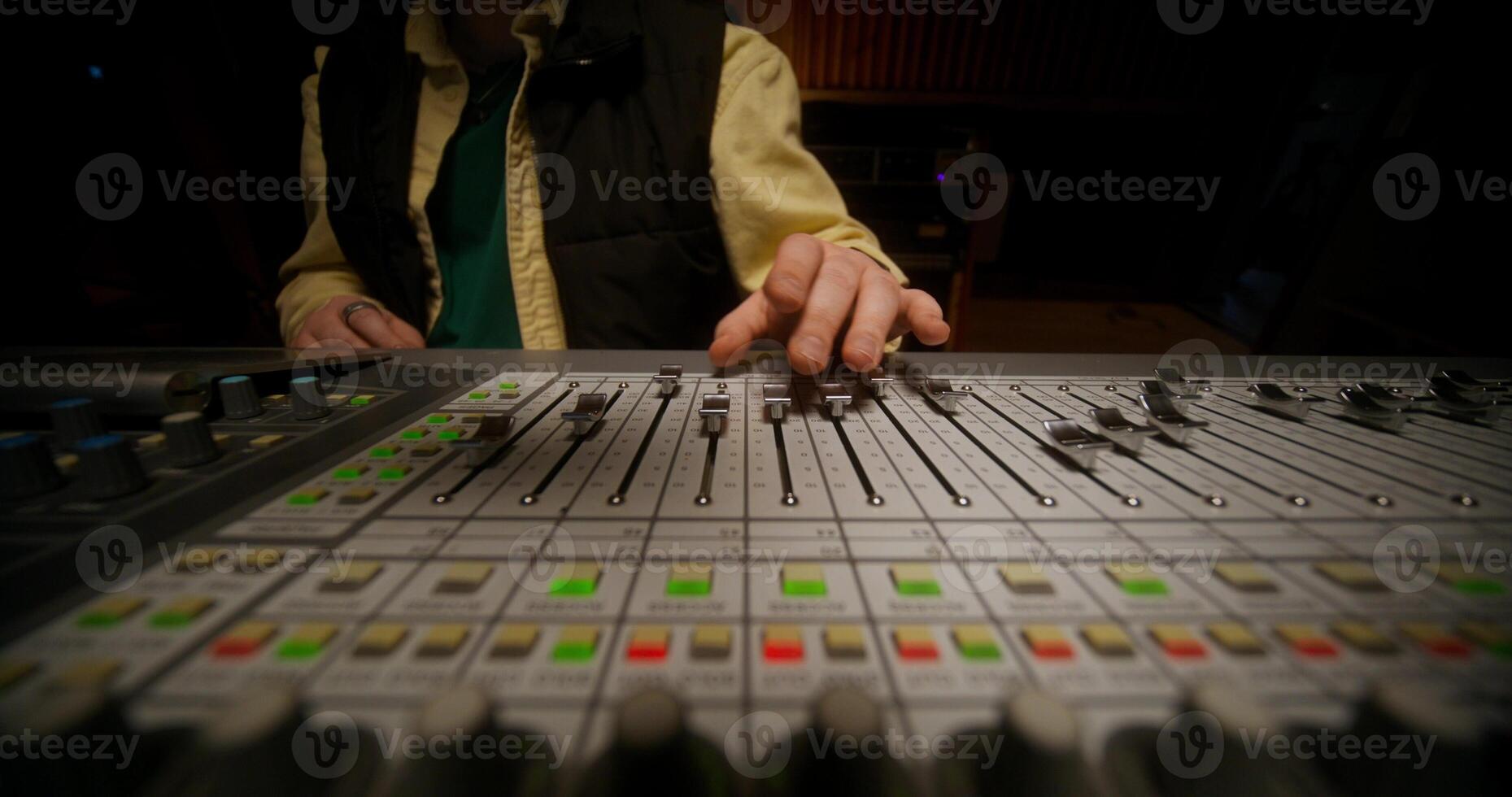 A person is playing a sound mixer photo