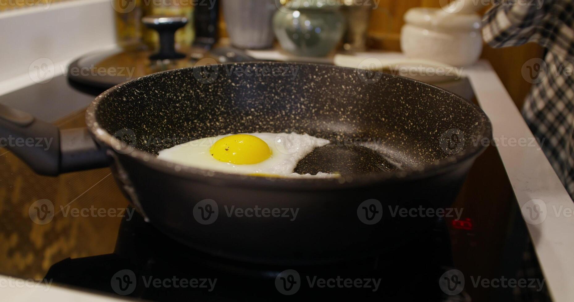 A frying pan with an egg in it photo