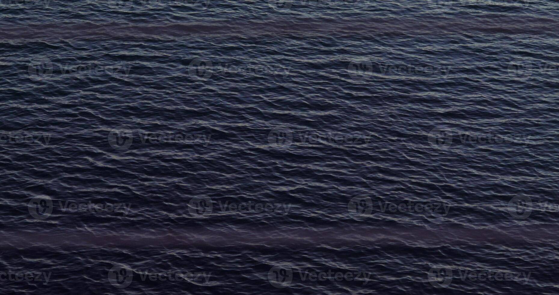 An aerial view of the ocean with a boat in the water photo