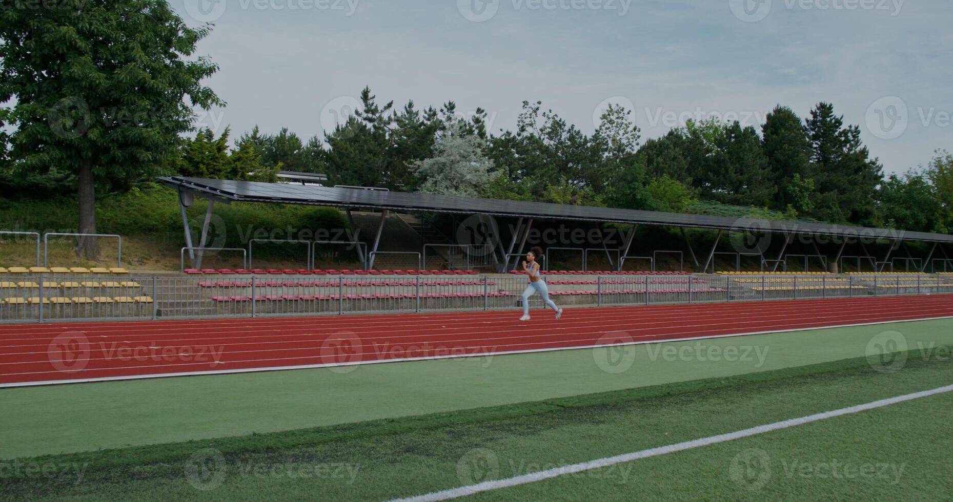 A woman is walking on a track photo