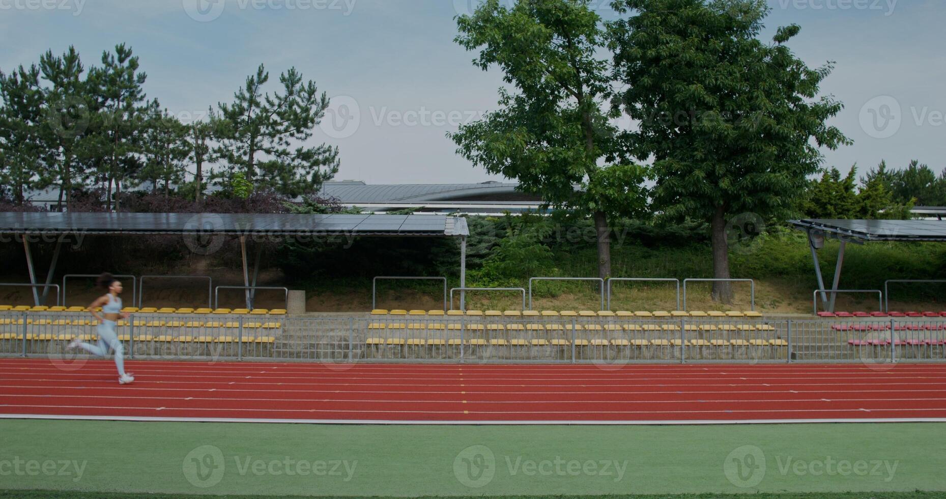 A person is running on a track photo