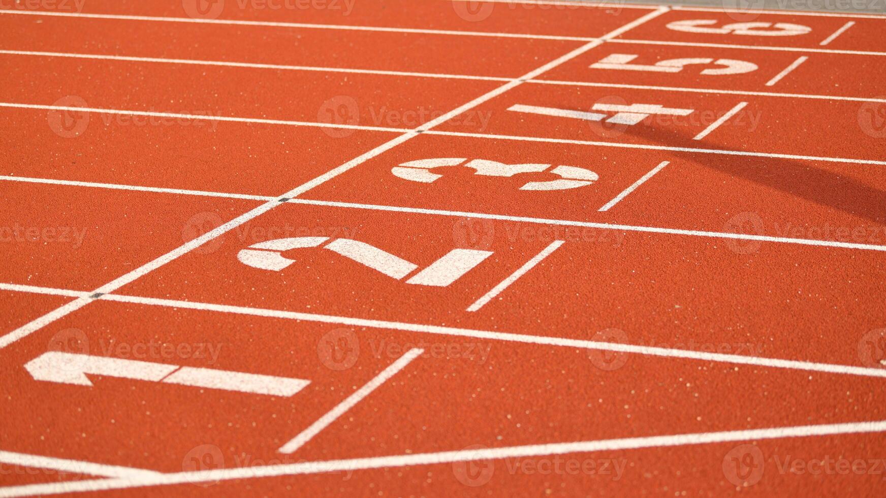 The red runway is numbered at a stadium photo
