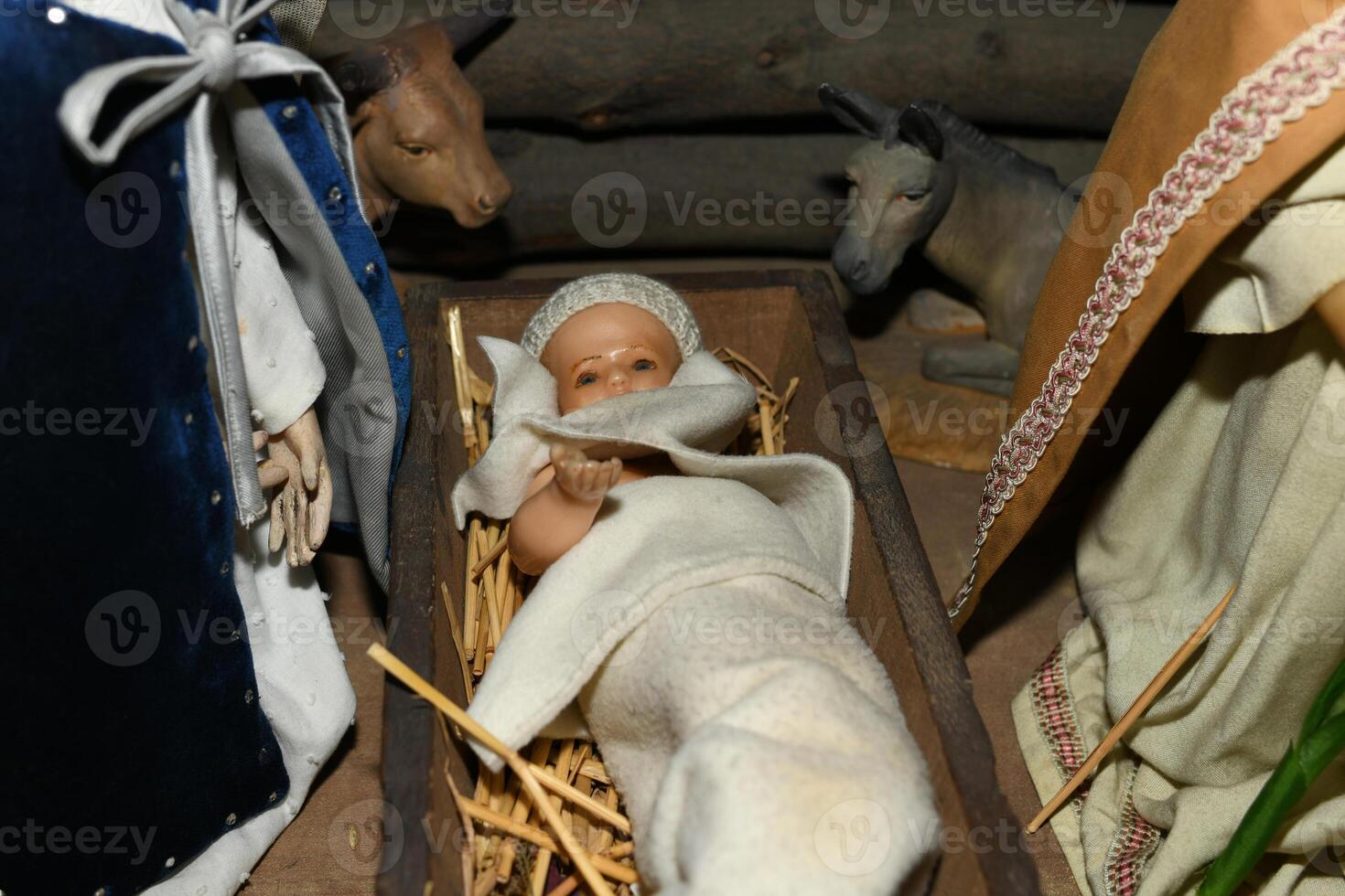 Baby Jesus laying in a cradle photo