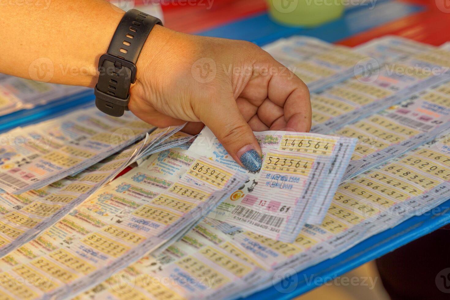 Thailand lottery Prizes are issued twice a month, i.e., 1st and 16th of the month, concept of gambling, wanting to get rich, hope, risk luck, have money. Soft and selective focus. photo