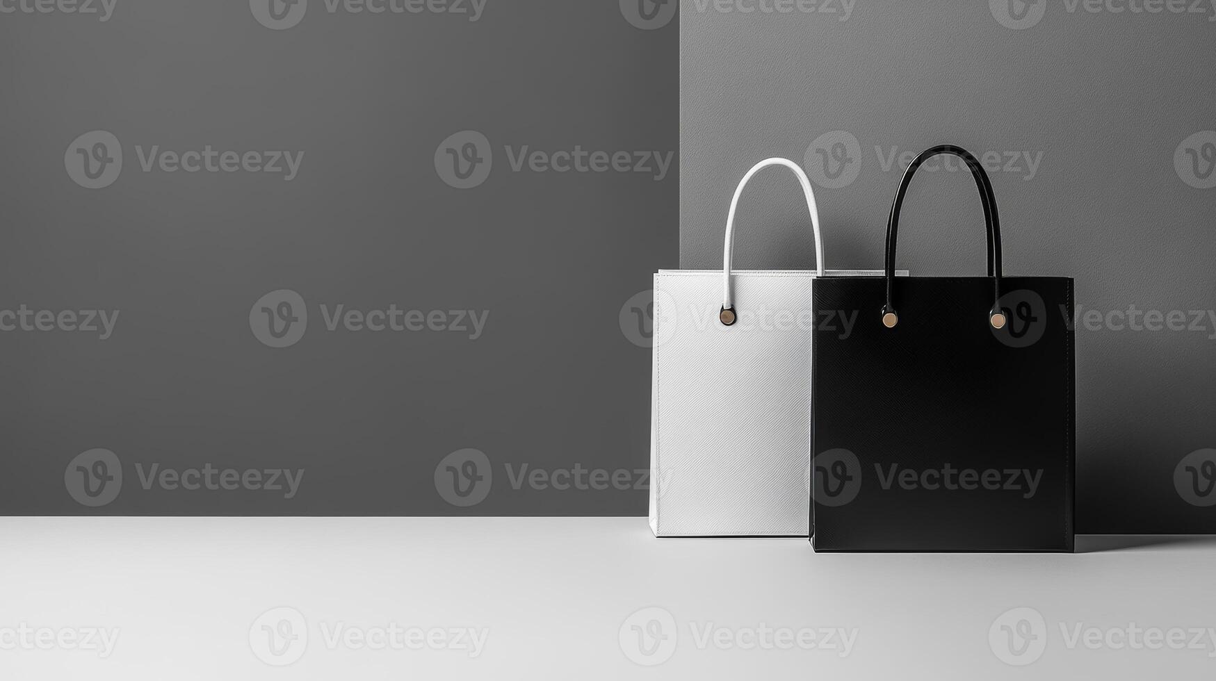 Stylish black and white bags displayed on a minimalist background in a modern setting with soft lighting photo