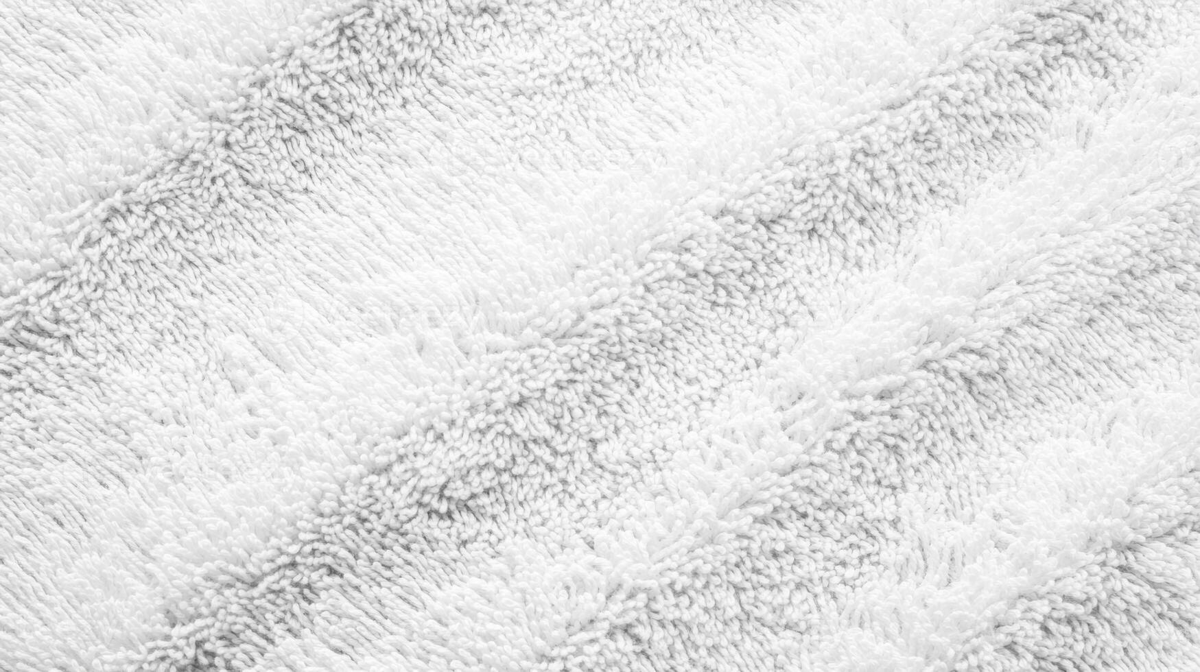 Soft white textured fabric with light shading and wave patterns providing a cozy and inviting appearance for home decor photo