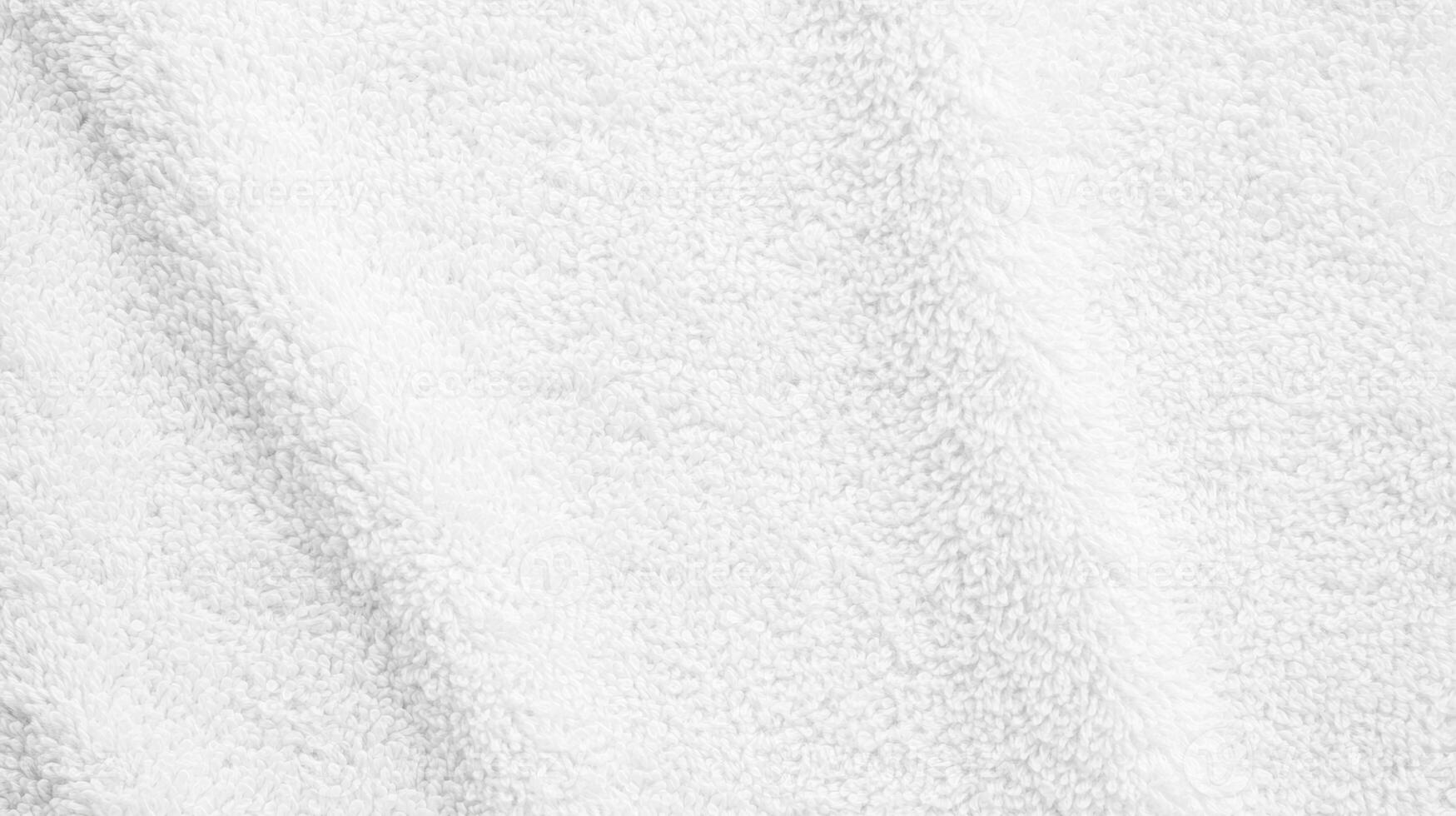 Soft white towel fabric with gentle texture and fluffy appearance suitable for various uses in home and spa settings photo