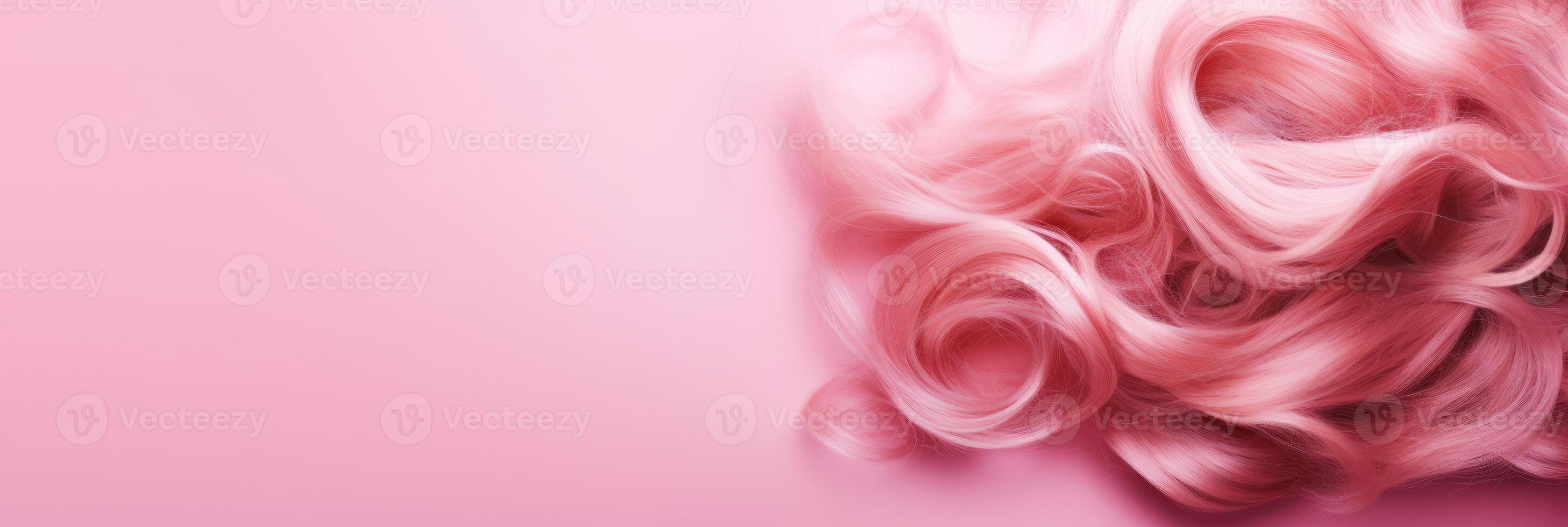 Wavy texture of healthy colored curly pink hair isolated on pink background, baner. photo