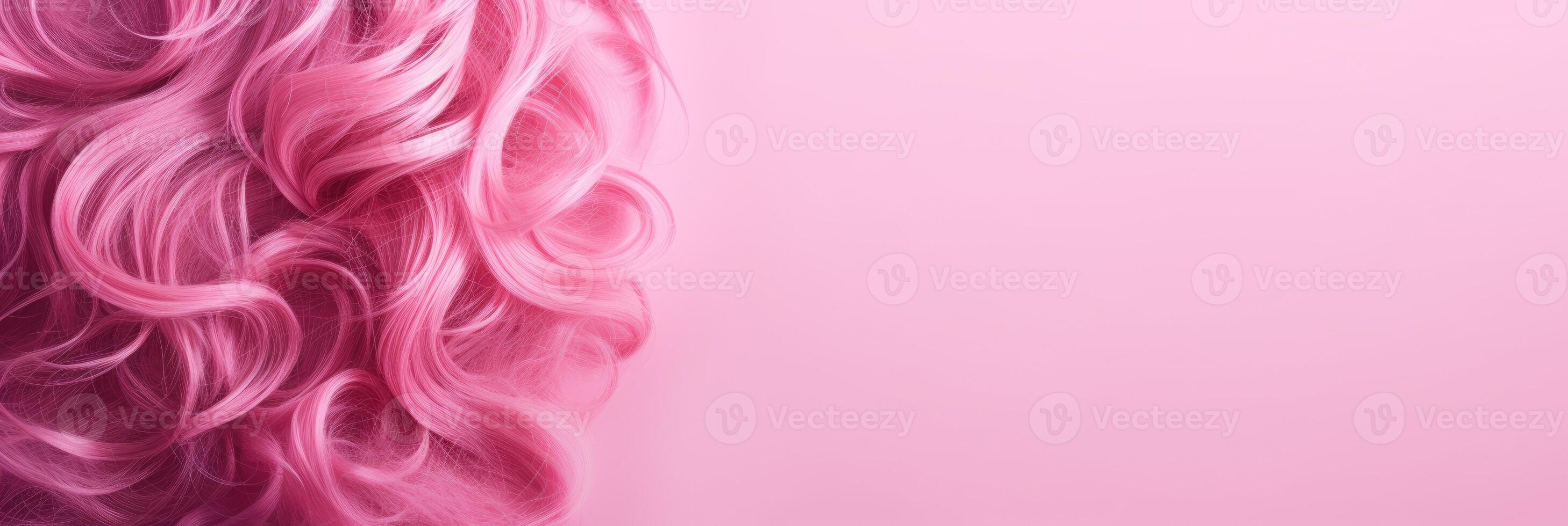 Wavy texture of healthy colored curly pink hair isolated on pink background, baner. photo