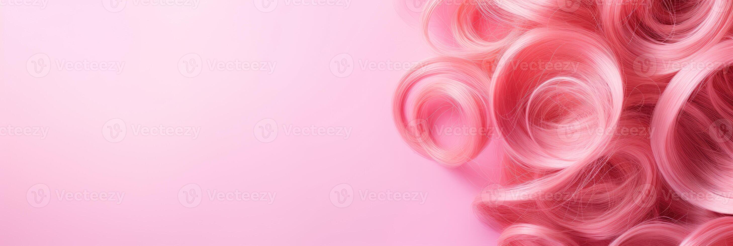 Wavy texture of healthy colored curly pink hair isolated on pink background, baner. photo