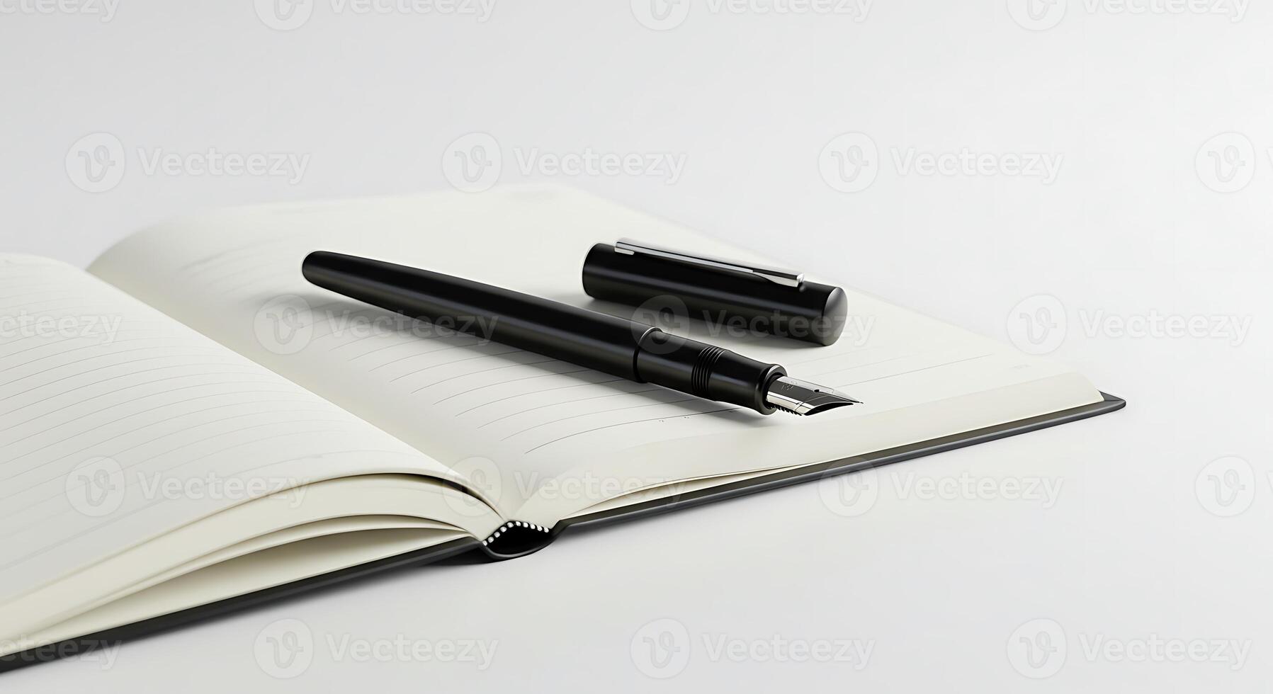 Black Fountain Pen Resting on Open Notebook with Lined Paper photo