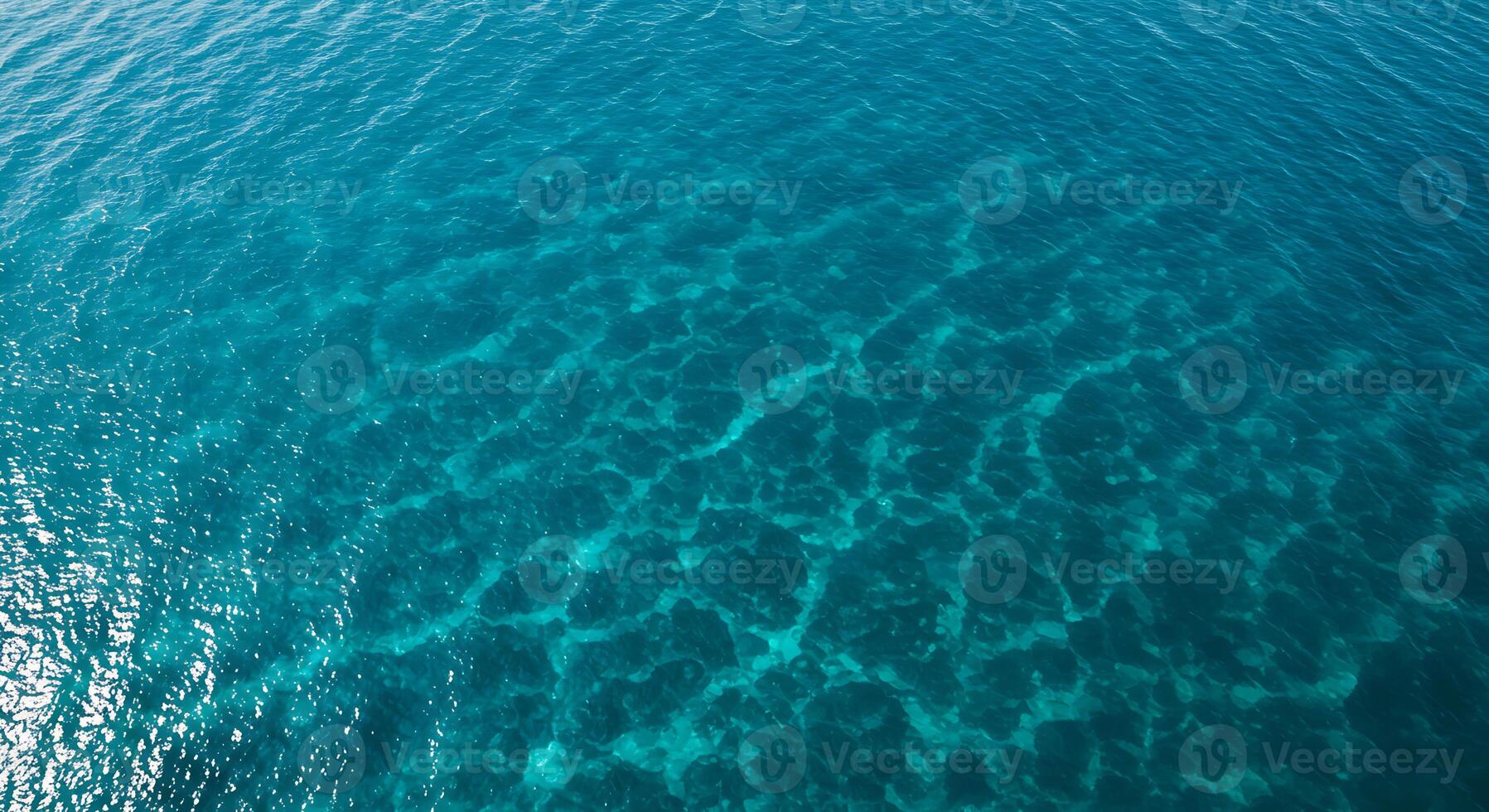 Turquoise Ocean Water Texture Sparkling in Sunlight From Above View photo