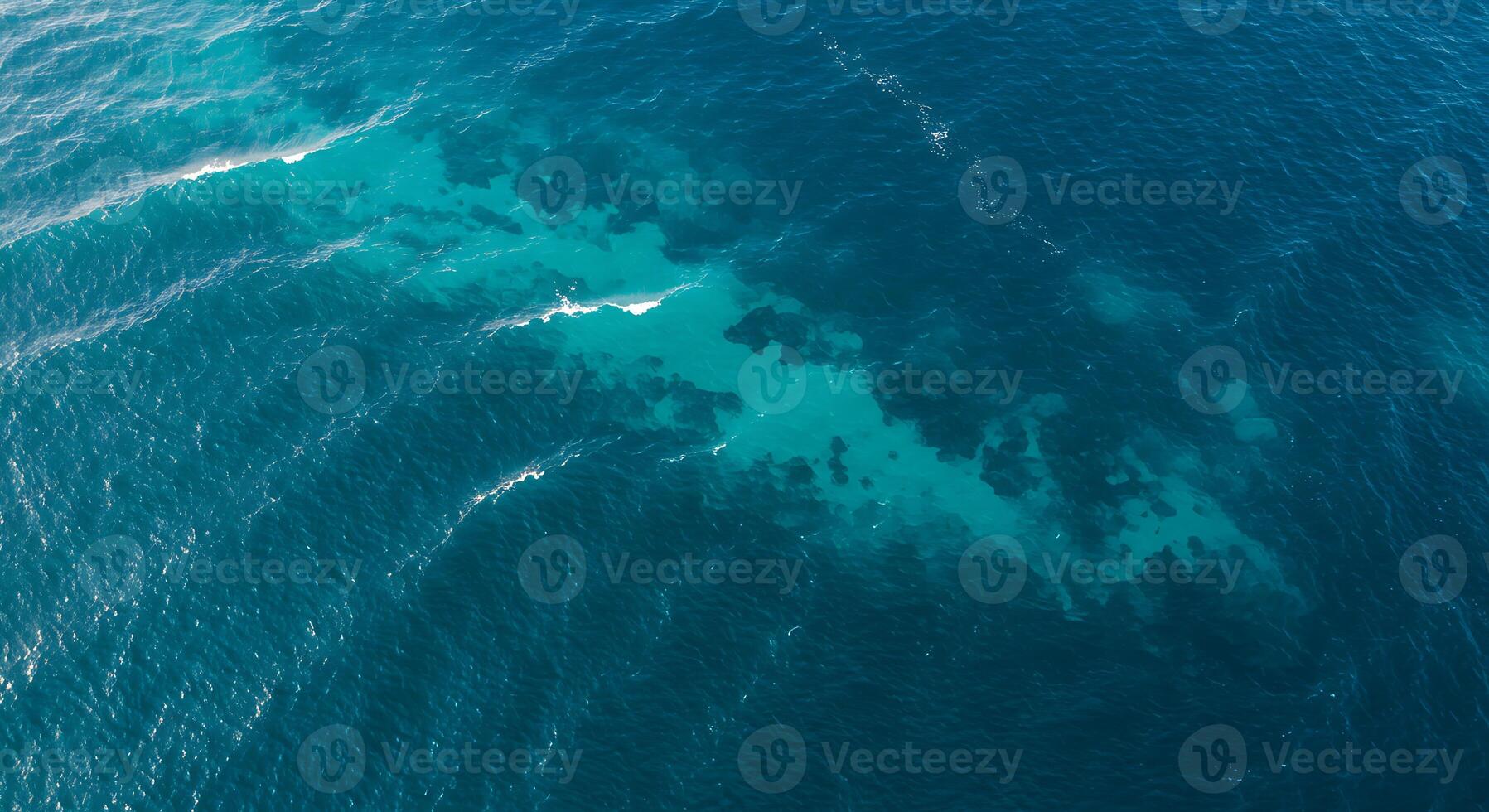 Aerial Ocean View with Turquoise Shallow Waters and Dark Blue Depths photo