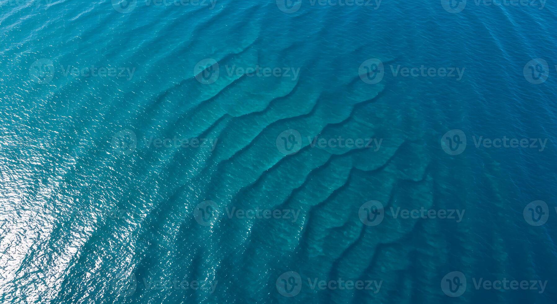 Aerial View of Ocean Water Showing Sandbars and Wave Patterns photo