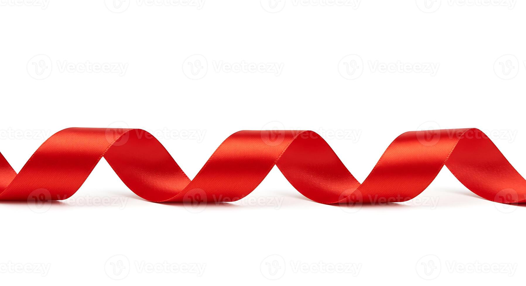 Red Ribbon Flowing in a Swirl on White Background for Decoration photo