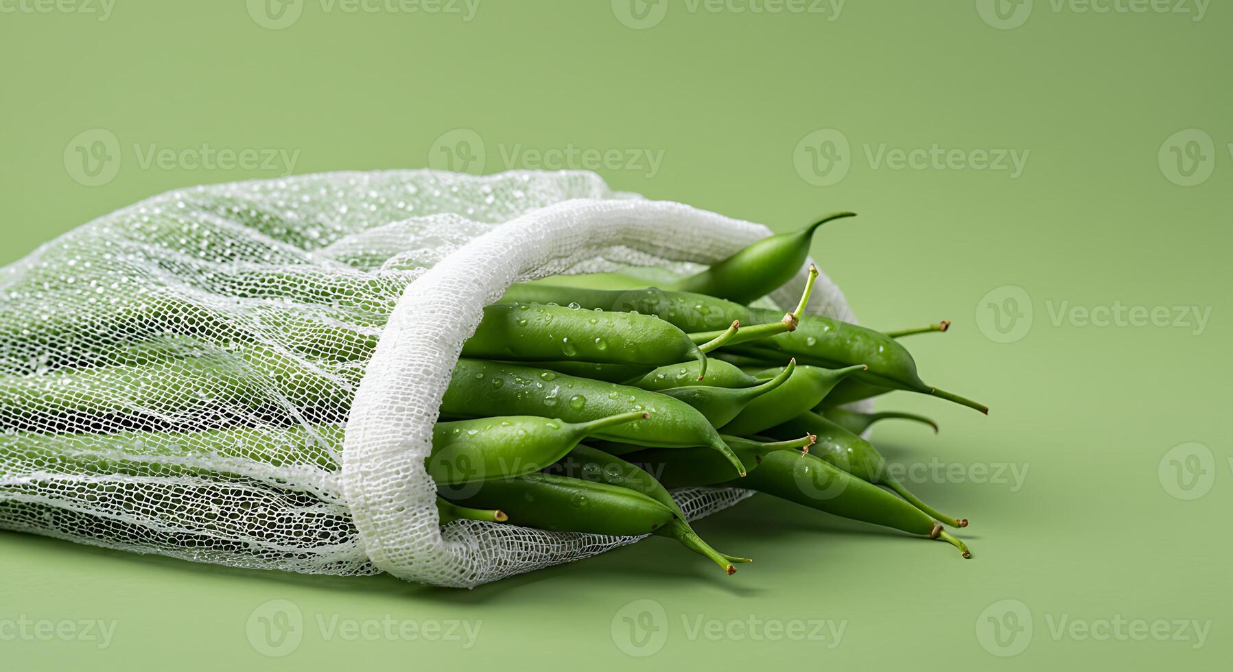 Green Beans in Mesh Bag on Green Background Freshness Concept photo