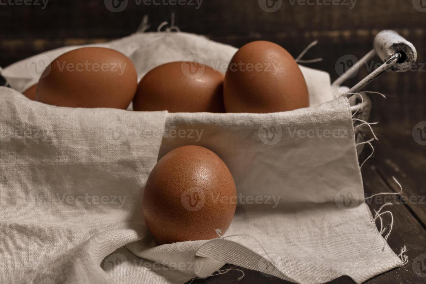 Eggs on wooden table photo