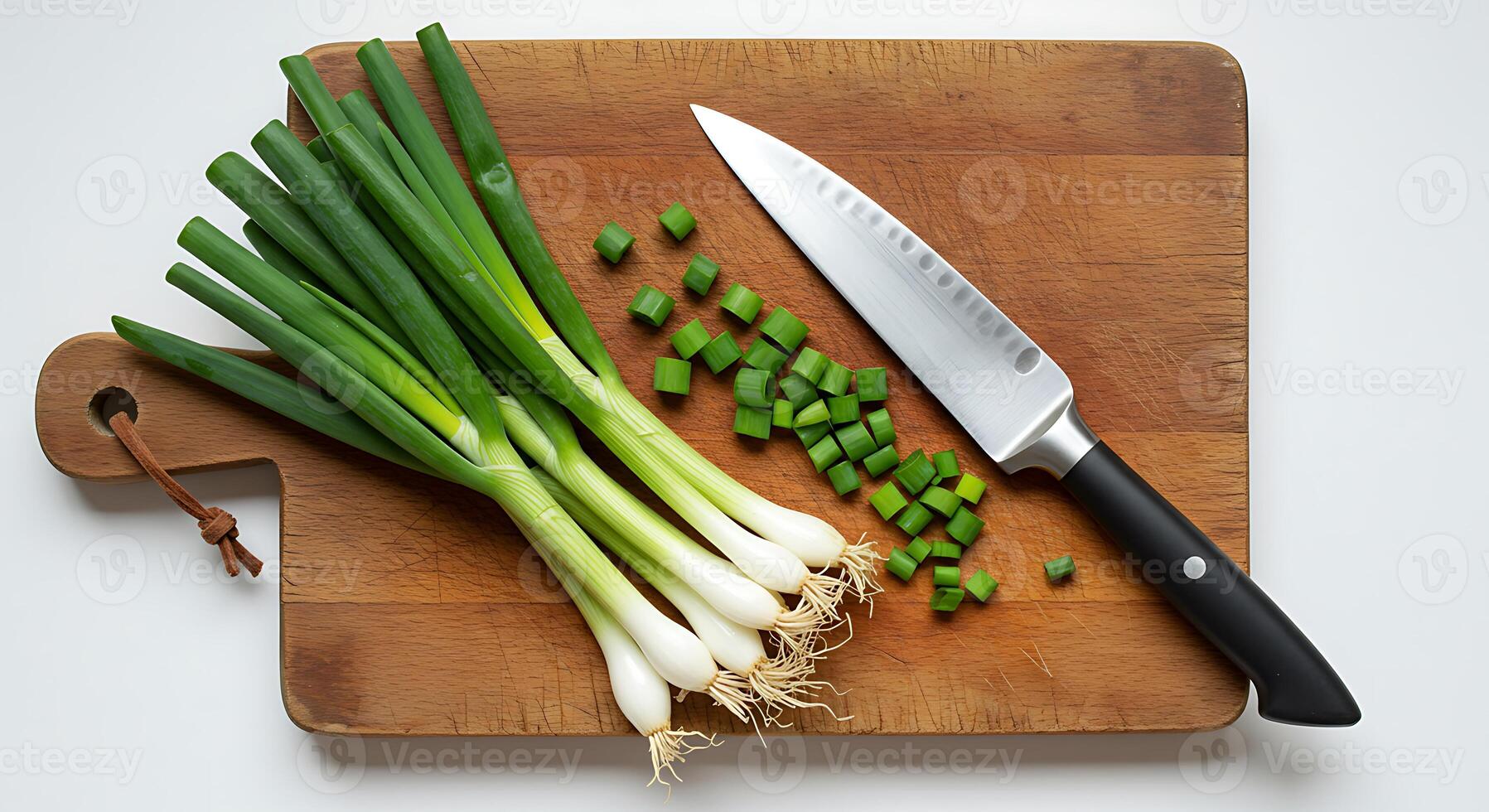 Preparing Fresh Green Onions with Knife on Cutting Board Food Prep photo
