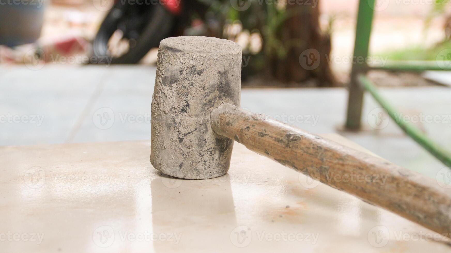 rubber mallet to seat tile photo