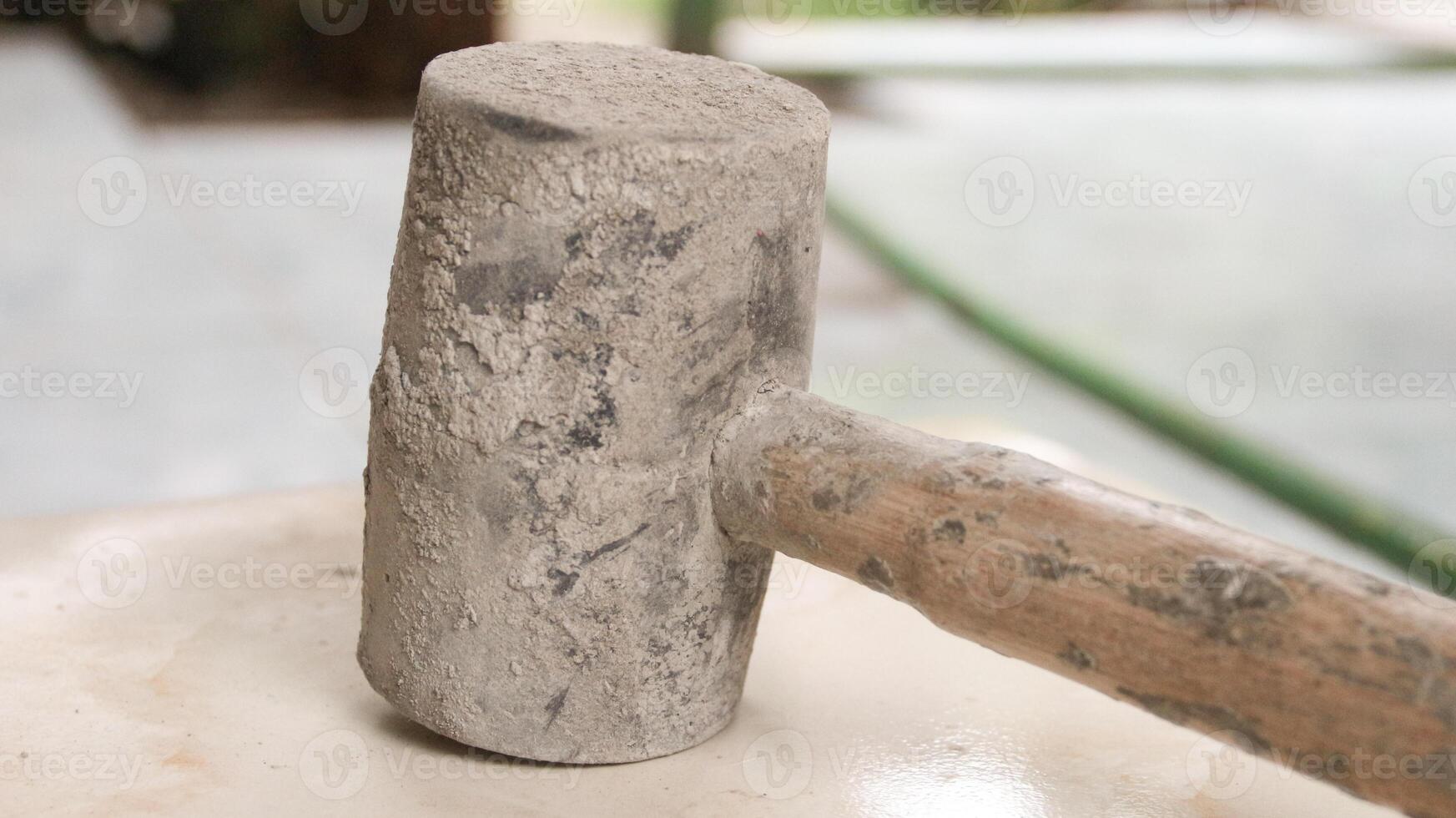 rubber mallet to seat tile. photo