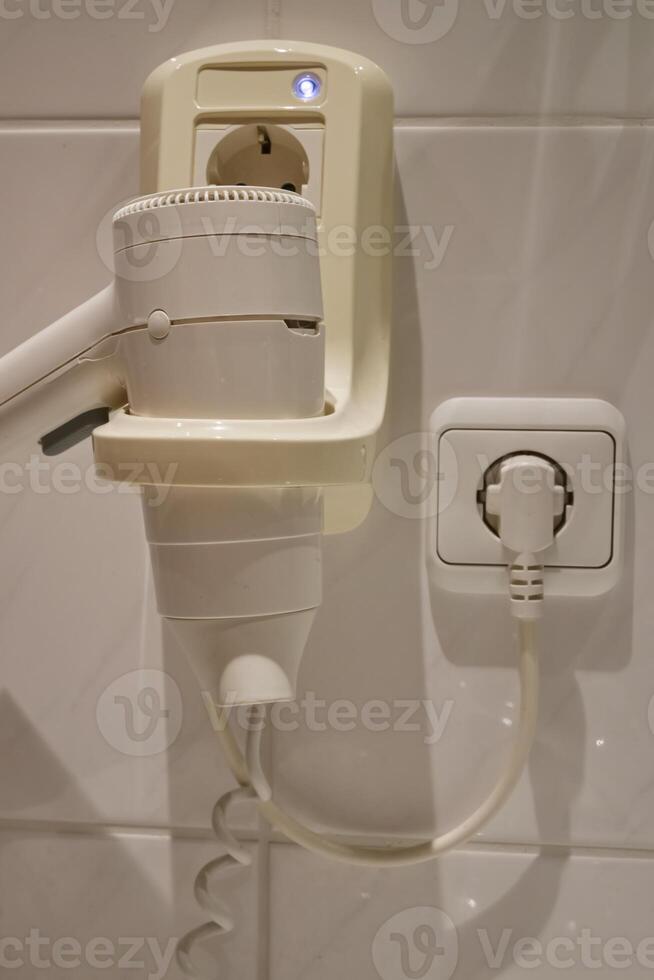 Wall-Mounted Hair Dryer with Power Outlet photo