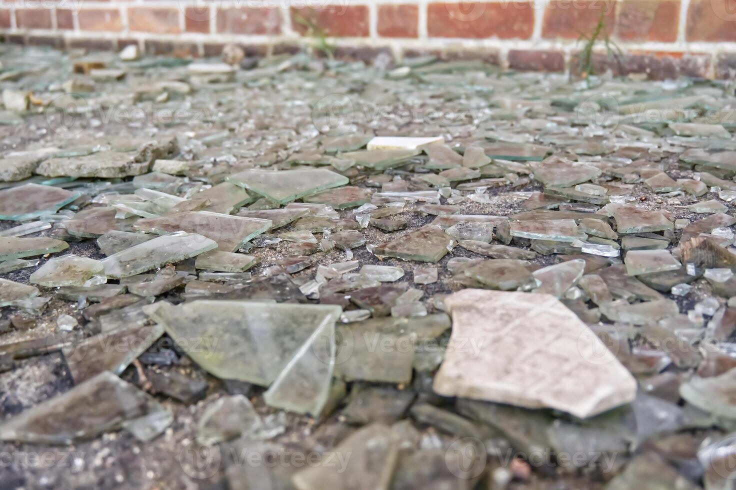 Close-Up of Shattered Glass on Ground photo