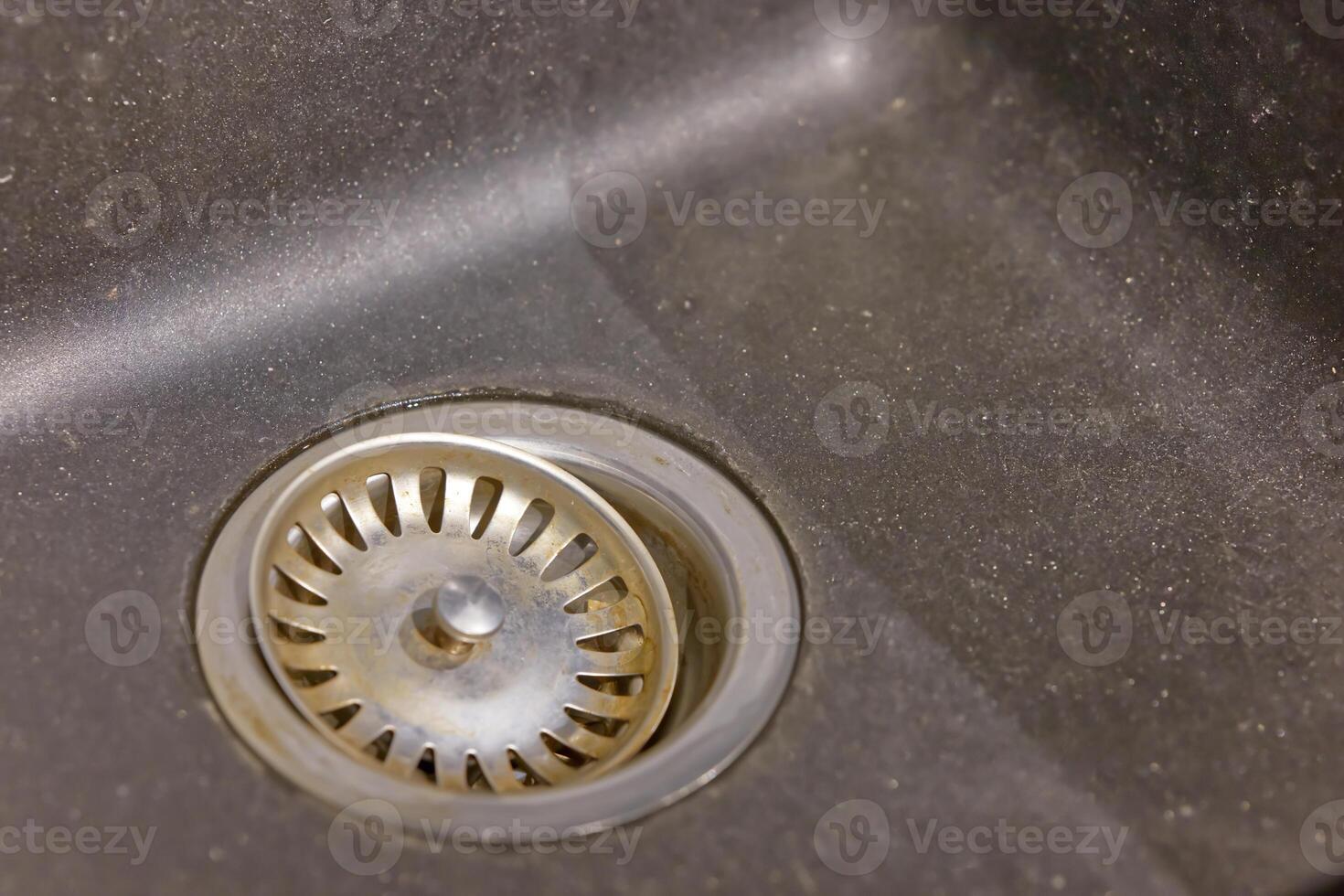 Close-up of a Dirty Kitchen Sink Drain photo