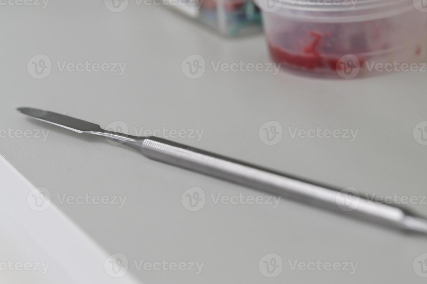 Close-Up of a Precision Metal Tool on a White Surface photo