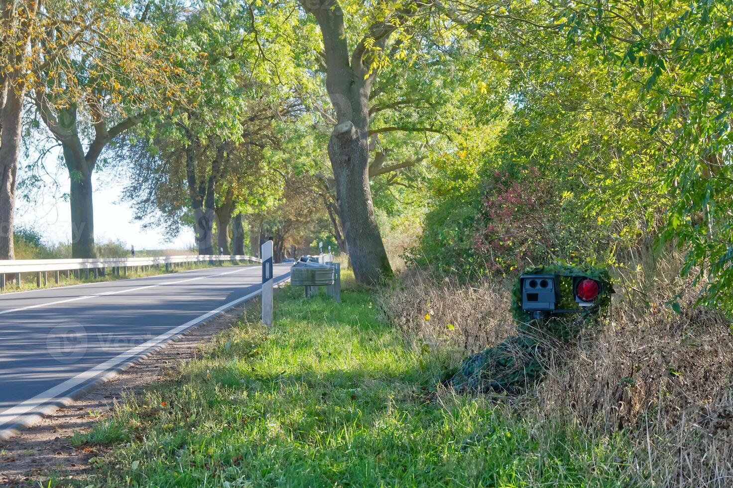 Camouflaged Speed Camera on Rural Road photo