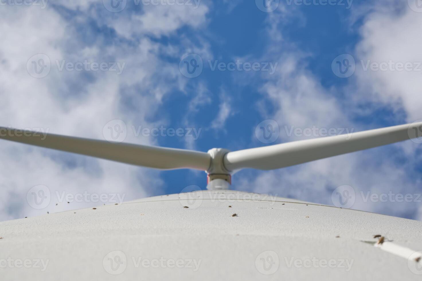 Wind Turbine Against Blue Sky photo