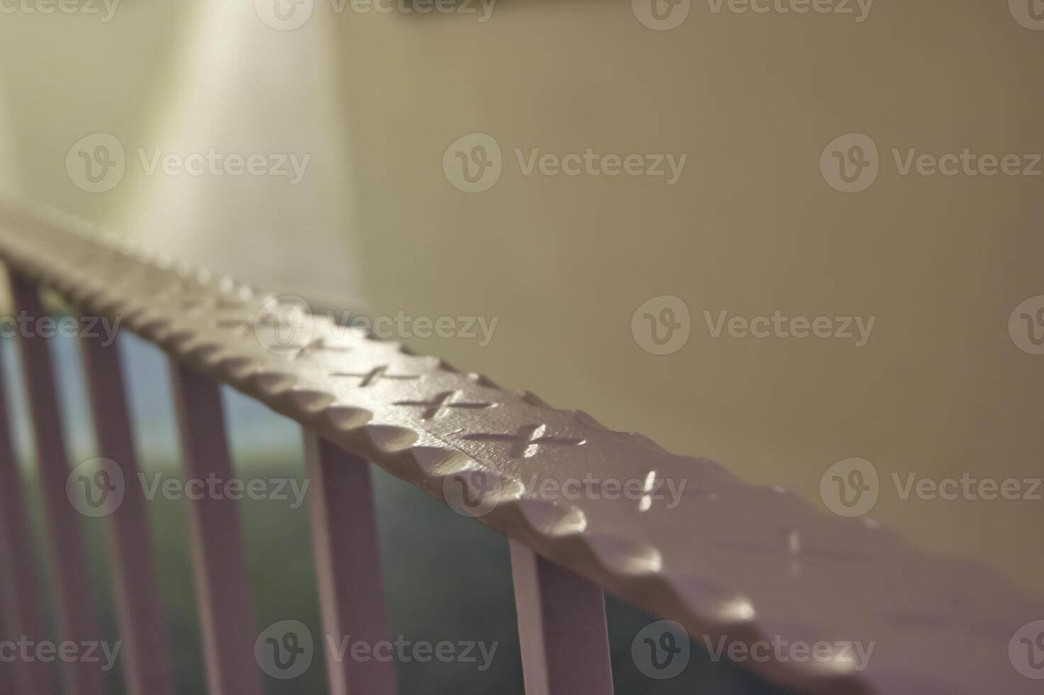 Textured Pink Railing Close-Up photo