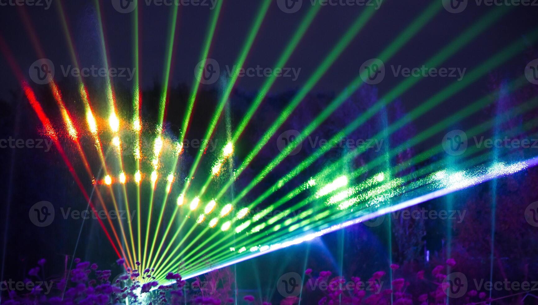 Colorful Laser Light Display at Night photo