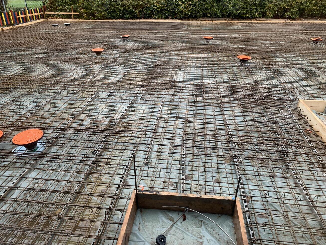 Construction Site with Rebar and Concrete Preparation photo